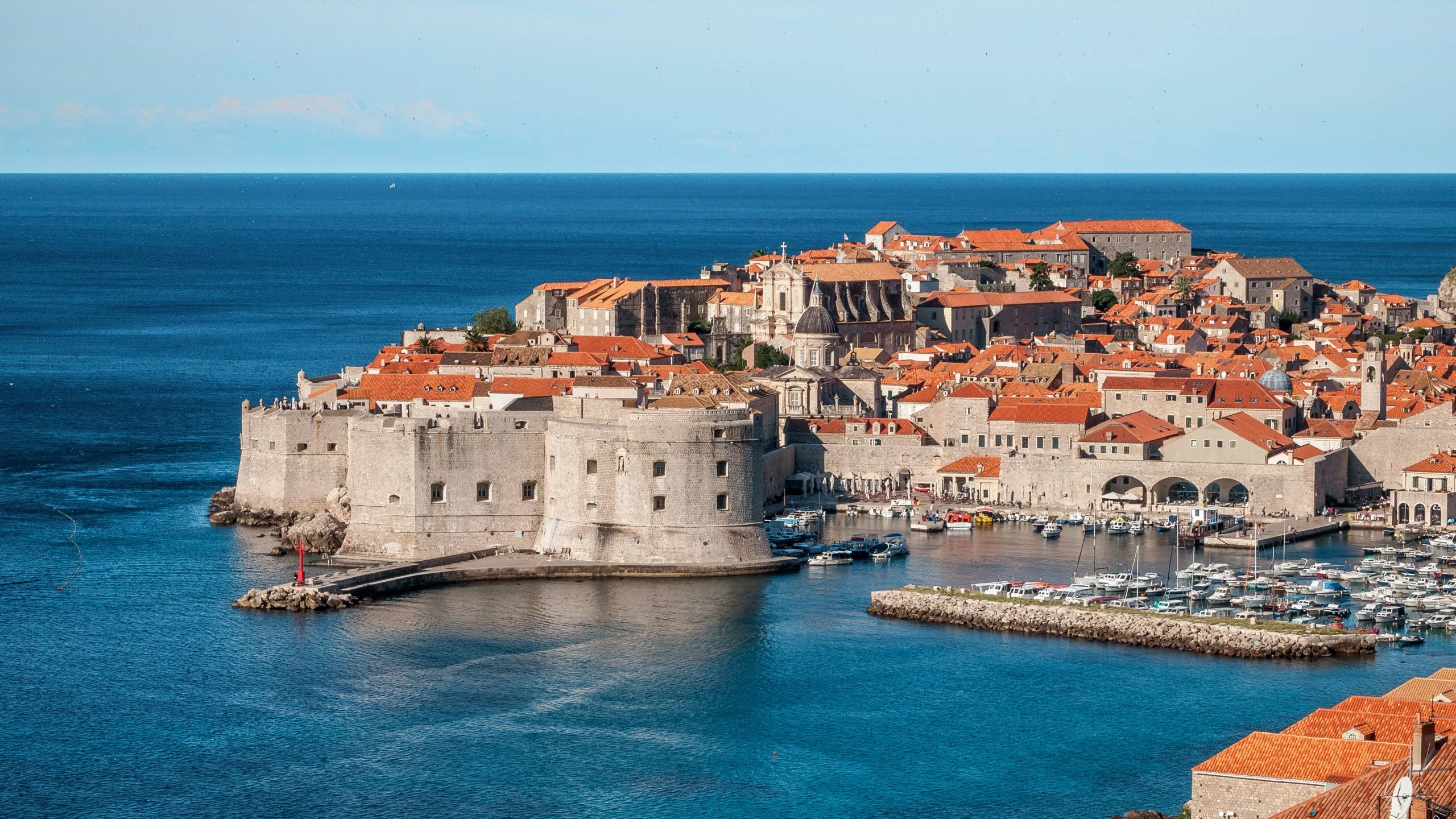 Dubrovnik's walled old town and its harbour jutting into the deep blue Adriatic